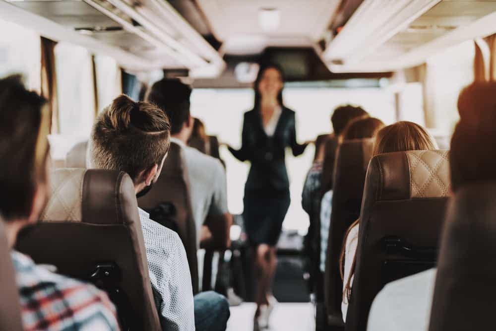 A group of people on a bus taking part in Historic House Tours in Indiana Dunes National Park.