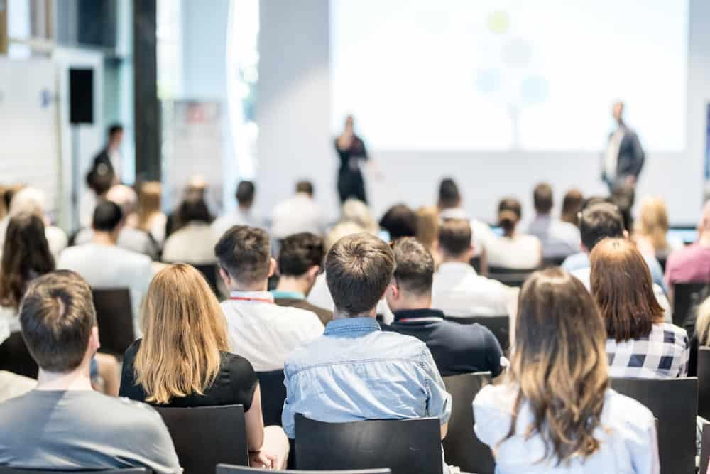 A group of people in an auditorium attending the RVIA Regulatory & Safety Compliance Seminar.