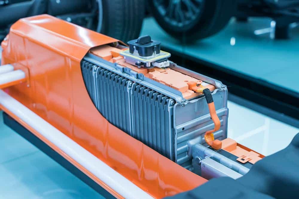 A Jayco orange car battery in a showroom, equipped with advanced lithium battery upgrades for off-grid power capabilities.