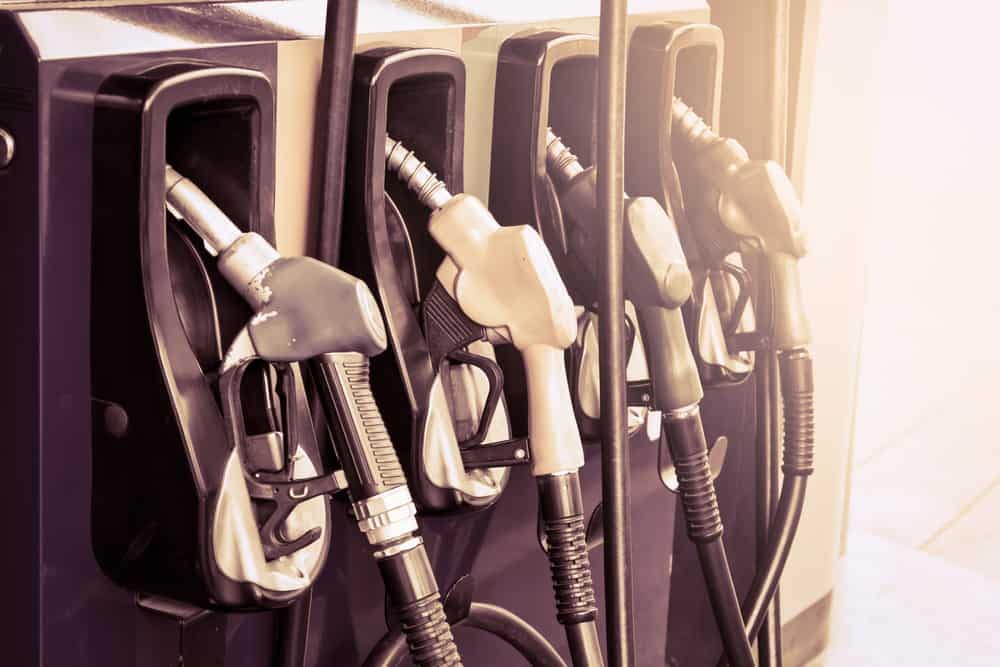 A group of gas pumps are lined up at a gas station, offering convenience for RVers looking to fuel up for their shorter trips.