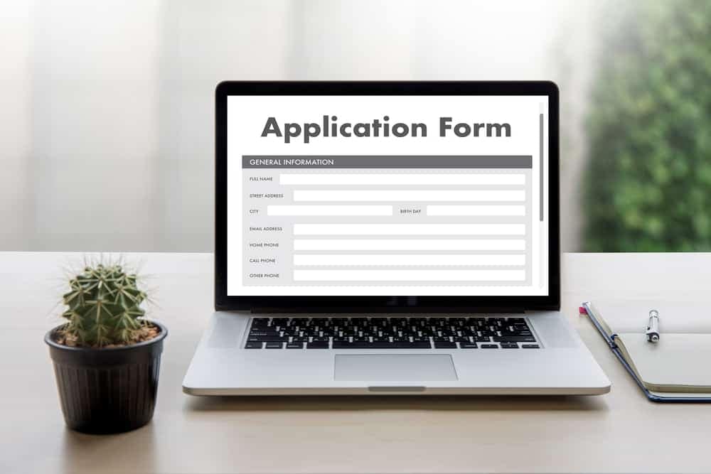 An RVIA laptop with a submissions form on it sitting on a table.