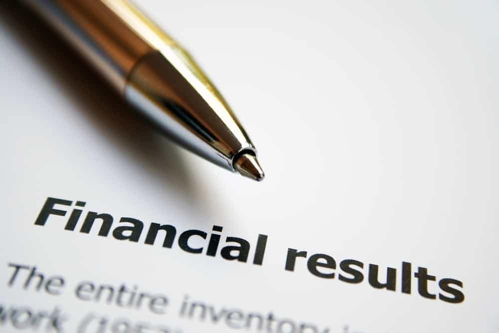 Patrick Industries' pen rests atop a Second Quarter 2022 Earnings Release financial report.