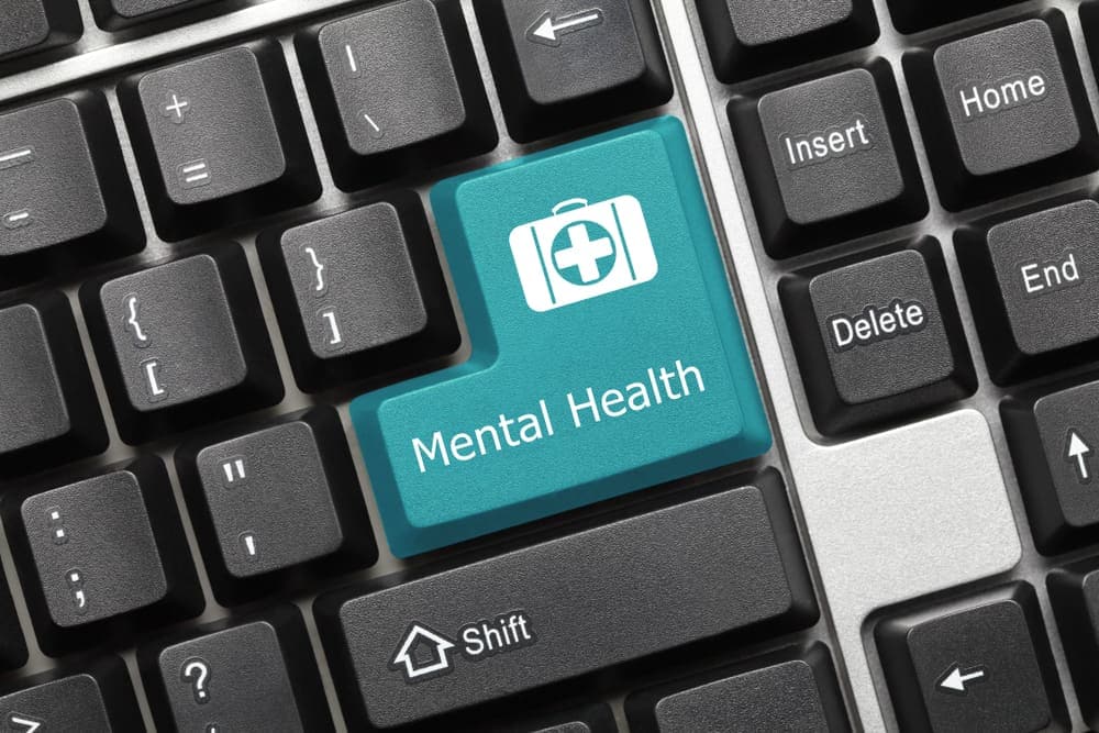 A blue button with the words "mental health" on it, promoting awareness and support for mental health in Canada.