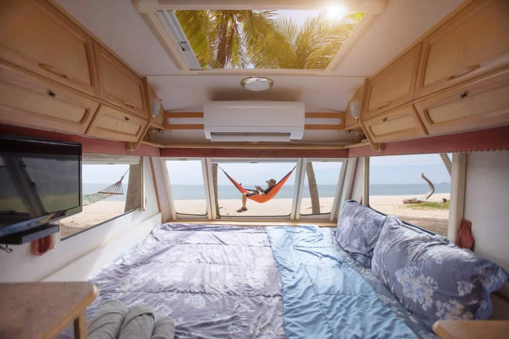 The inside of an RV at a Caravan Park in Queensland, with a hammock on the beach.