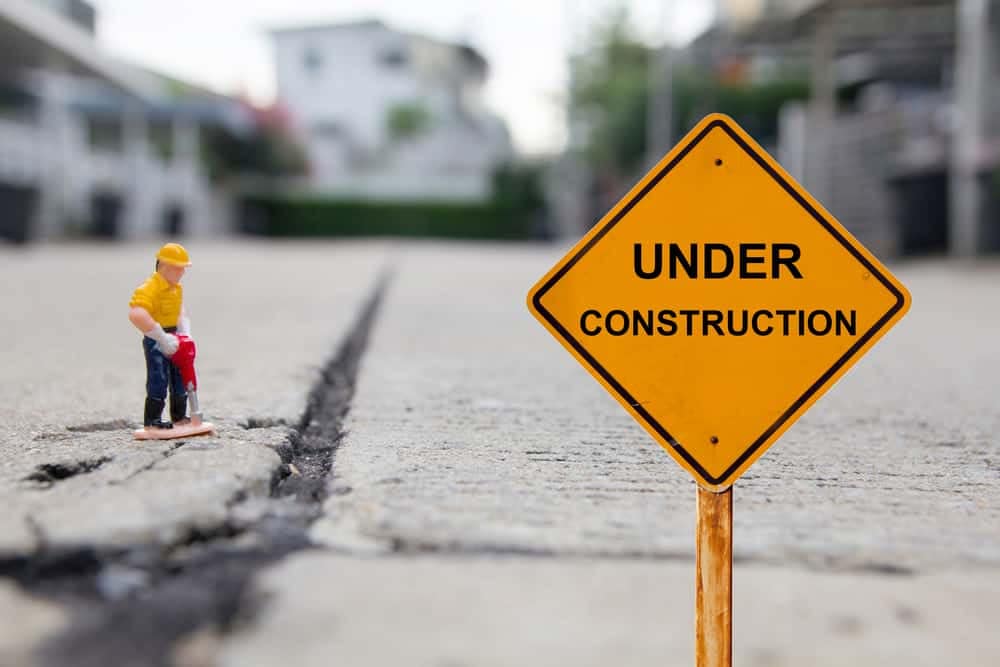 A toy construction worker next to an under construction sign at the Frank Russell campground during the 2023 camping season.