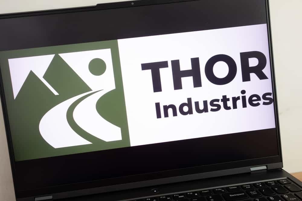 The THOR Industries logo is prominently displayed on a laptop computer.