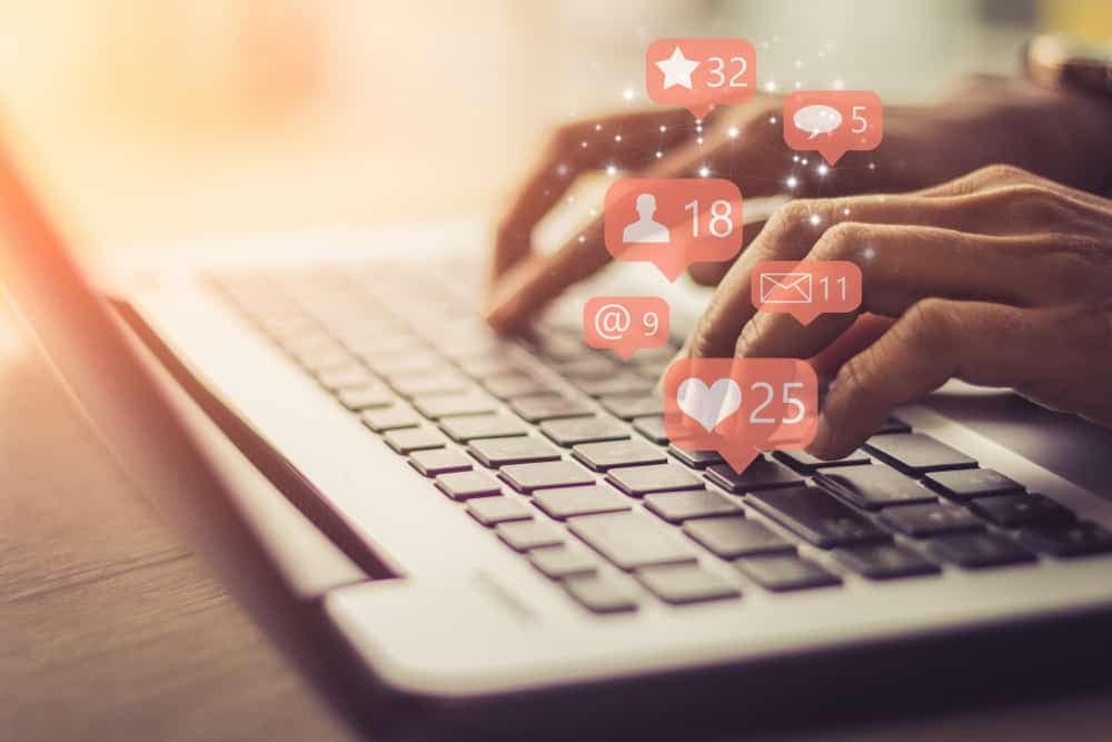 RMS North America, the leading provider of campground marketing solutions, offers a comprehensive toolkit that includes social icons for convenient online sharing. Witness a person in action, passionately typing on their laptop, utilizing