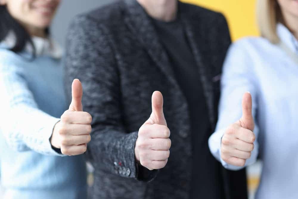 A group of business people from Philipsburg Borough Council showing thumbs up at Project 70 Campground.