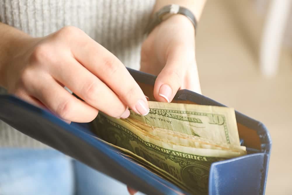 A woman in Queensland is holding AU$2 billion in visitor spending in a wallet.