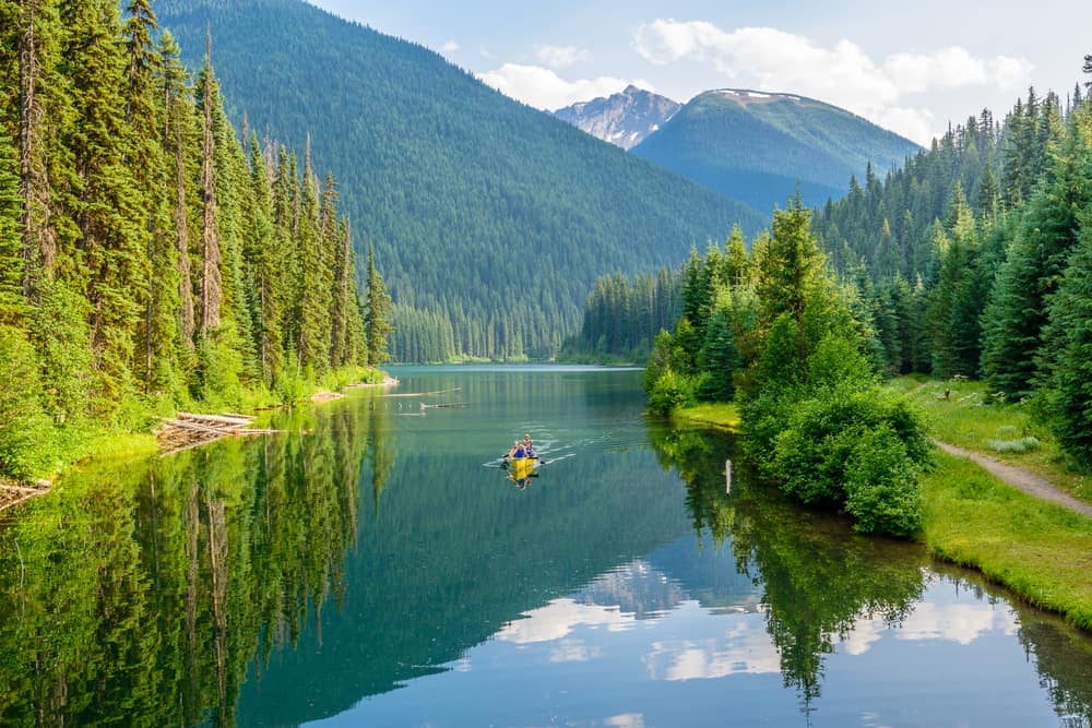Canoeing on a lake in the mountains with increased support from the B.C. Gov't and Outdoor Rec Group.