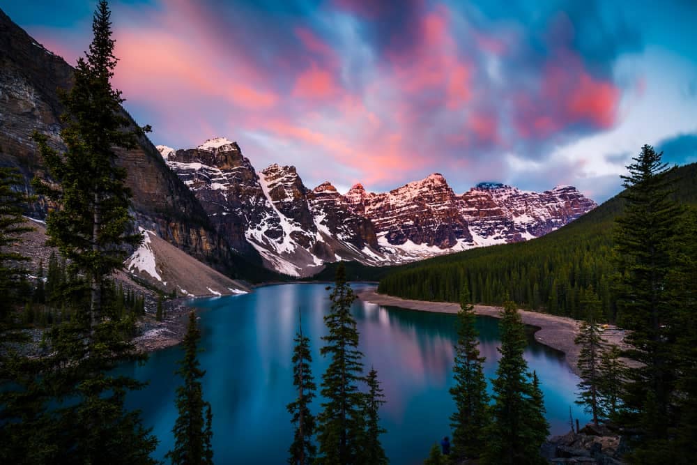 Sunset over a mountain lake in Banff National Park, one of Alberta Parks' breathtaking campgrounds.