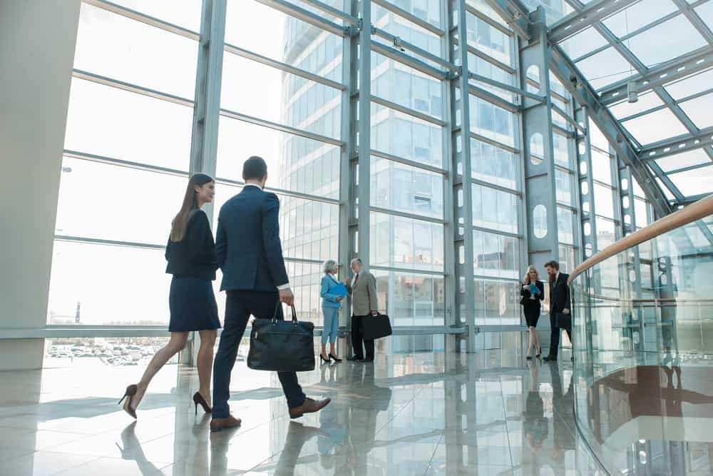 The RVIA Government Affairs Team, consisting of e-RV Infrastructure experts and business people, walking through an office building.