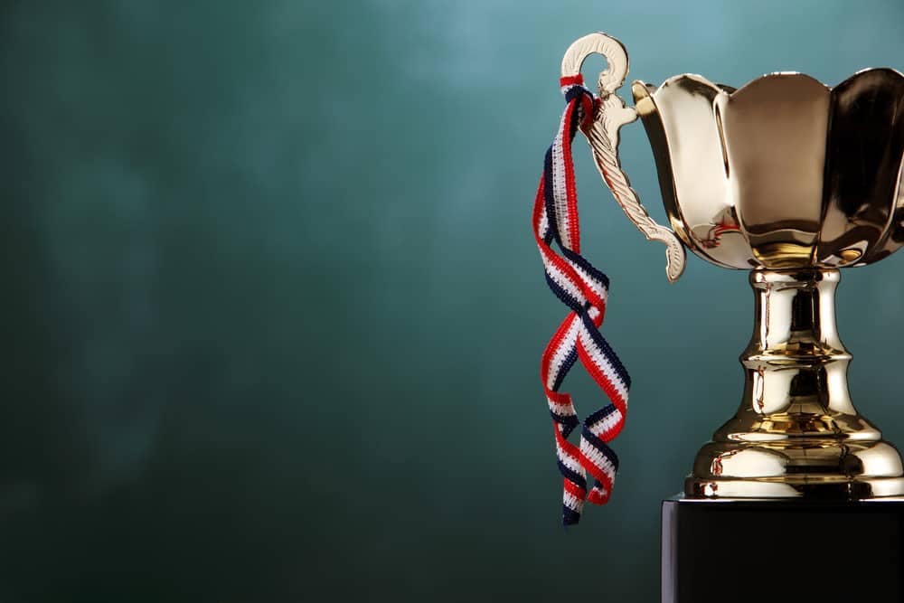 A gold trophy, representing an award nominations criteria, sits on top of a black background at the CCRCV.