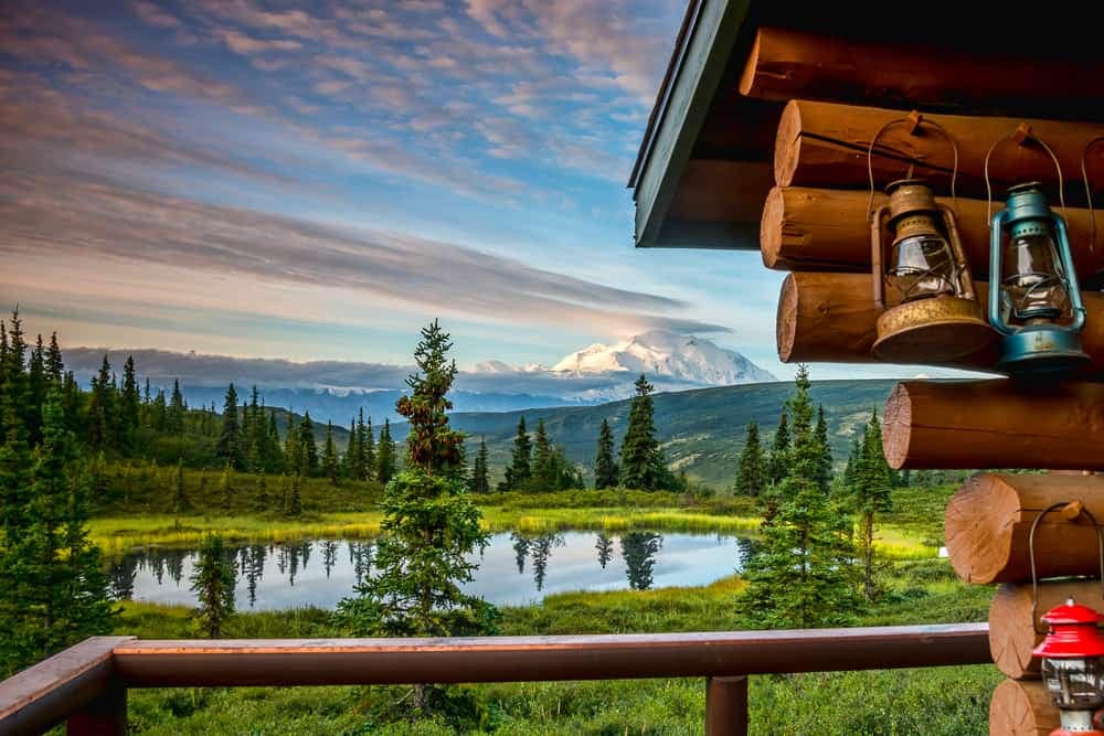 A campground with a view of a lake and mountains in Alaska.