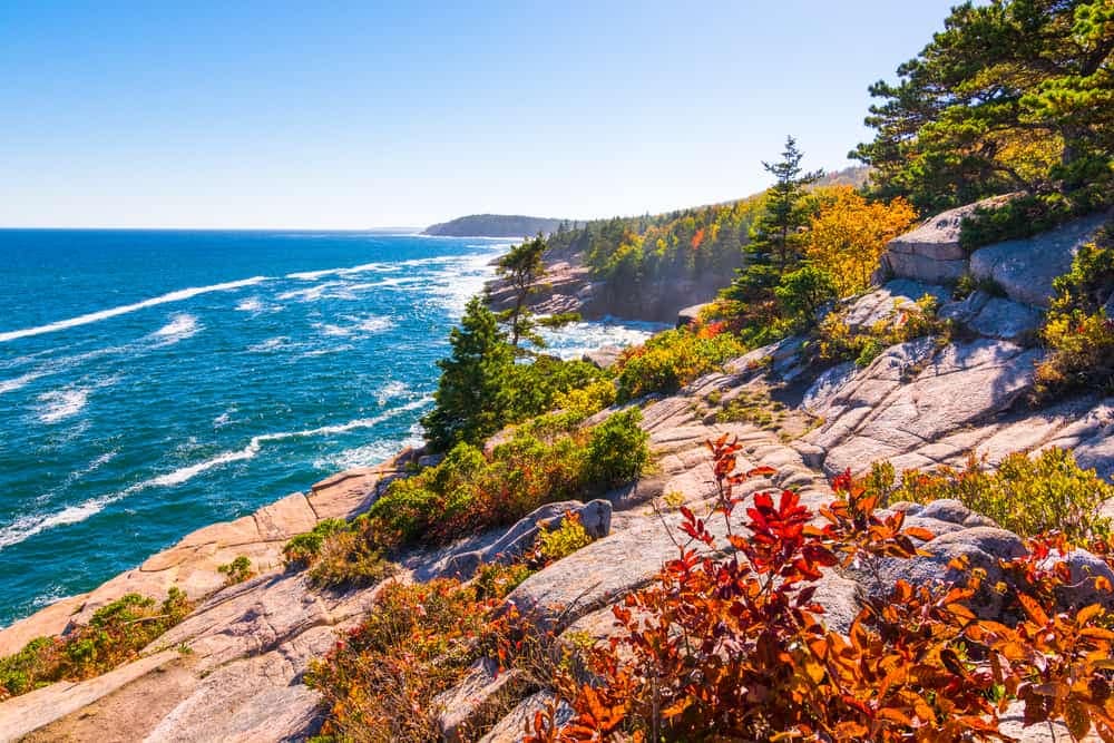 A scenic view of the ocean from a rocky cliff at Acadia National Park.