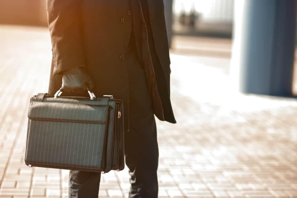 Don Bennett Jr., President and CEO of Campground Owners of New York, is holding a briefcase.