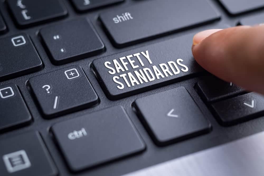 A person pressing a button on a computer keyboard to input RV Safety Standards.