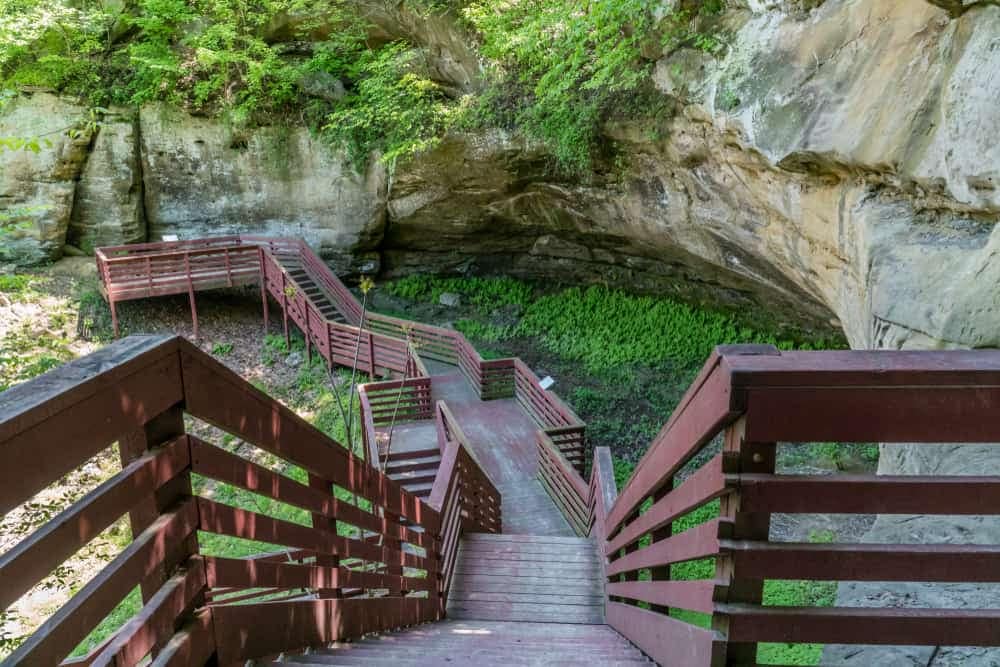 An upgraded wooden walkway leading up to a cave in southeast Nebraska state parks.