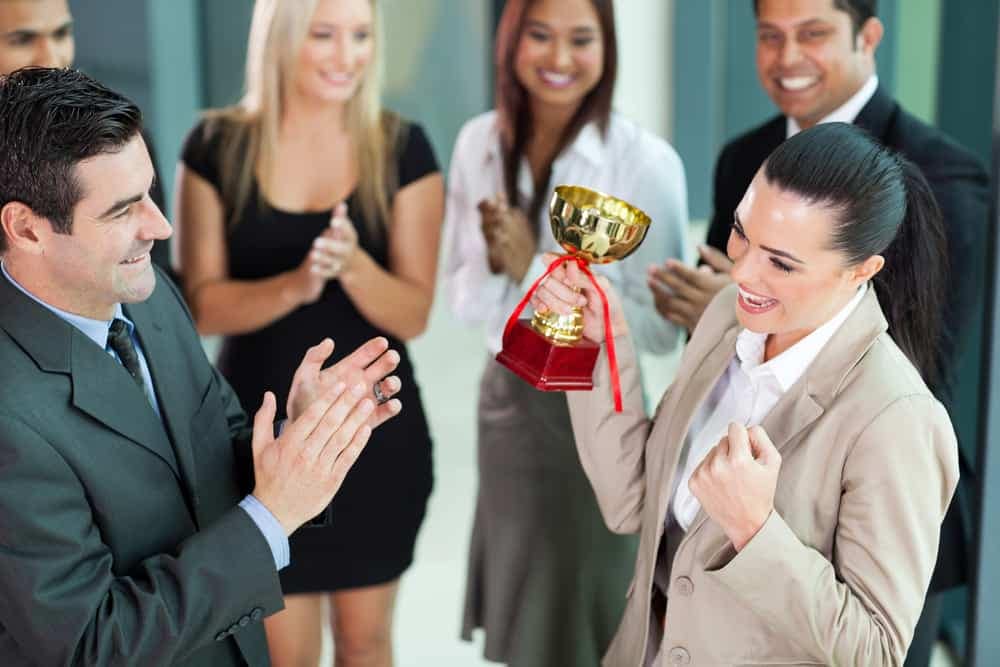 A group of business people clapping in celebration of the RVWA Awards.