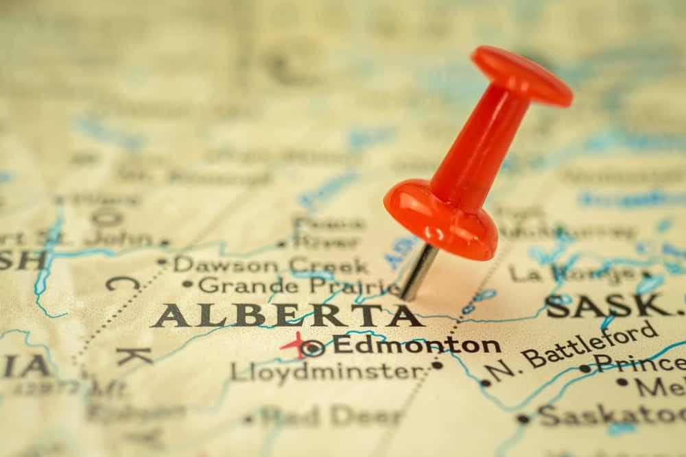 The Canadian Gov't invests in tourism-focused projects by pinning a red pin on a map of Alberta.