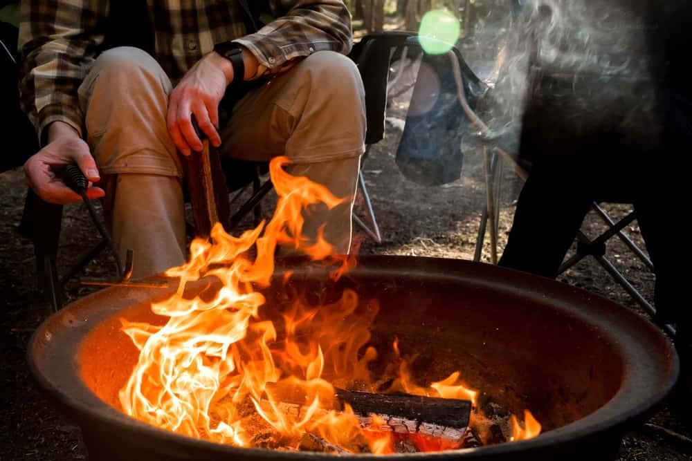 Steve Stafford, Director of Franchise Sales for Yogi Bear's Jellystone Park, sits around a campfire.