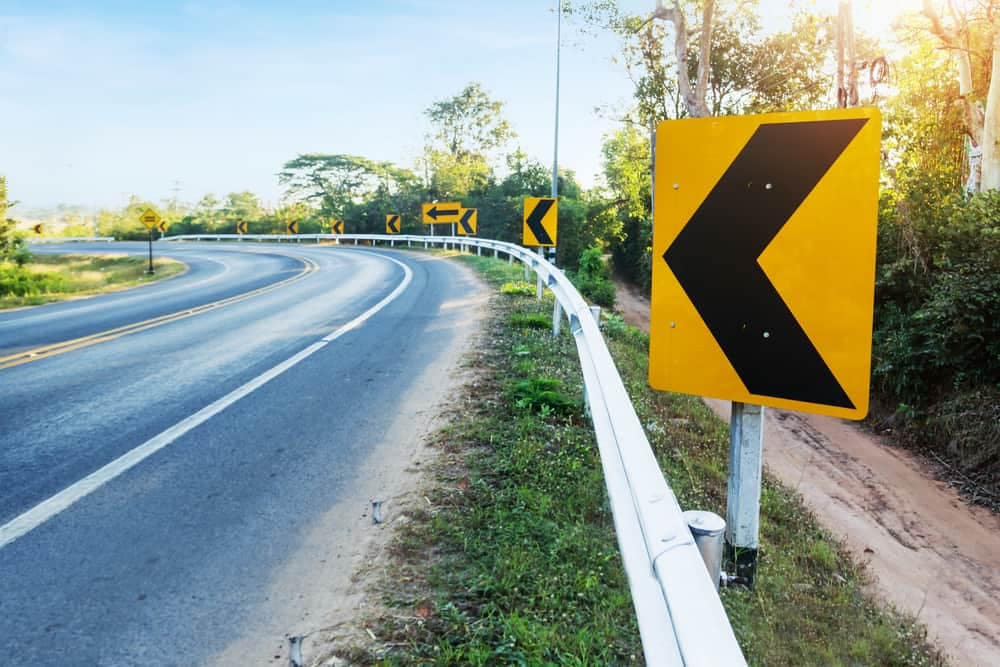A road sign for RVers and Australian campers with arrows pointing in different directions to promote road safety.