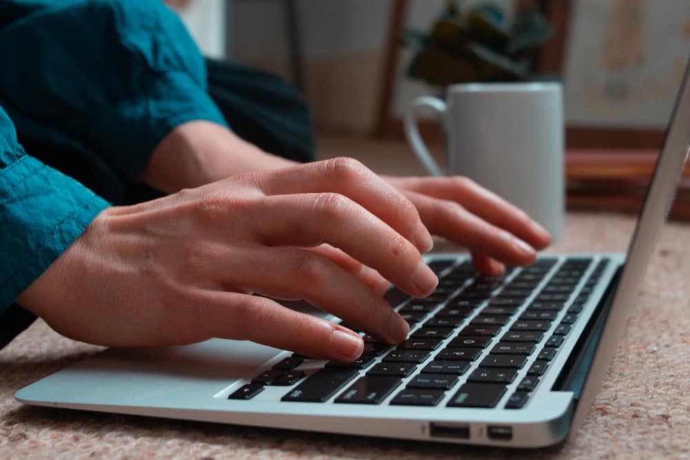 A person using the interactive revenue calculator on their laptop.