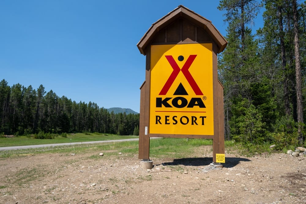 Preferred Alternative Koa resort sign in front of a forest.