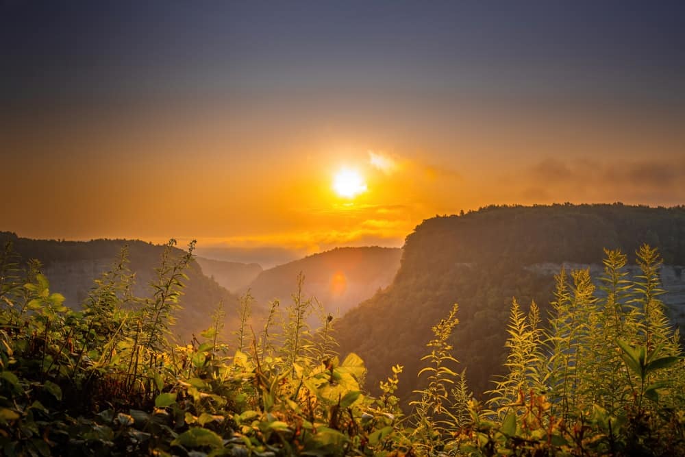 In 2024, a Total Solar Eclipse graces the skies over a picturesque valley in the mountains of New York State Parks.
