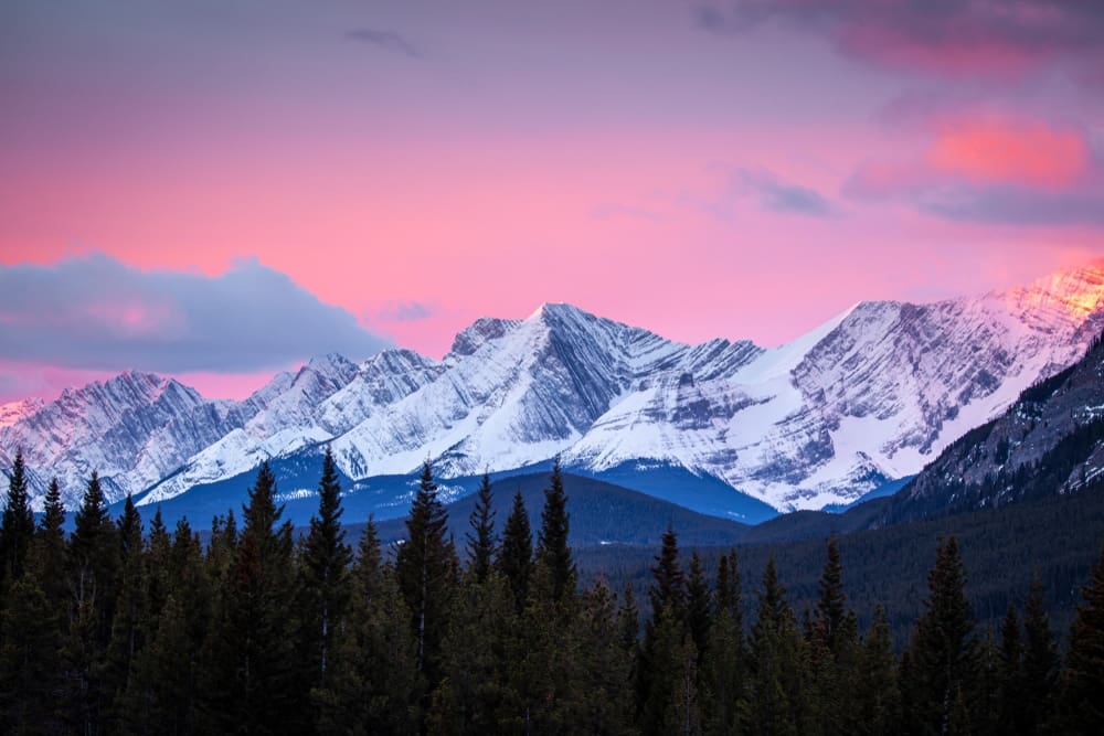 Albertans can witness the breathtaking sunset over the mountains in Banff, Alberta, immersing themselves in the great outdoors.