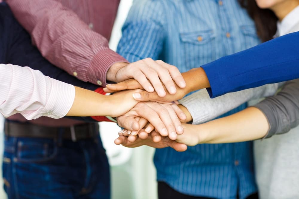 A group of people forming a circle.