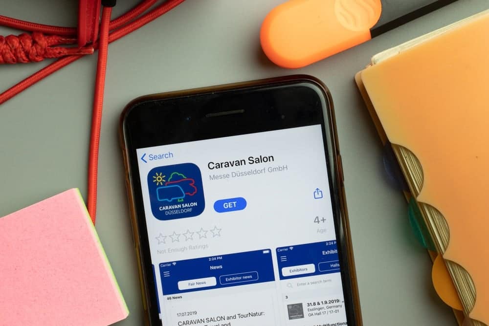A cell phone featuring the word "survey sales" designed to ensure success at Düsseldorf Caravan Salon 2023.