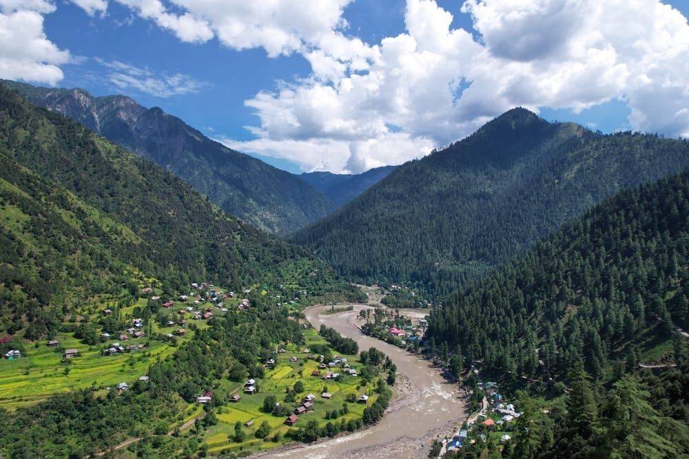 An aerial view of Neelum Valley, a village nestled in the mountains known for its sustainable path and ecotourism initiatives by AJK's Sustainable Path.