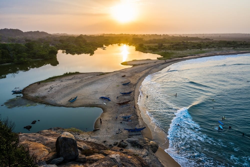 The sun is setting over Arugam Bay, a vibrant beach destination that is part of a Tourism Plan aimed to revitalize the area.