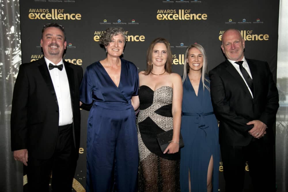 A group of people posing for a photo at the Jayco Newcastle Awards Event, one of the Beacon of Excellence occasions in the Caravan and Camping Industry.