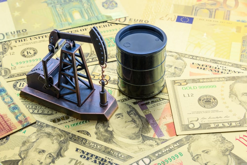 Pump on a pile of money, symbolizing the pressure on higher oil prices.