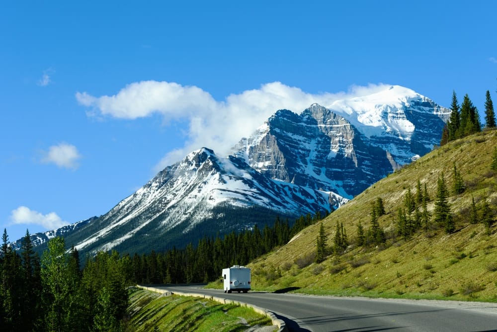 Canadian RVers, Shane Devenish, drive south in their truck on a road.