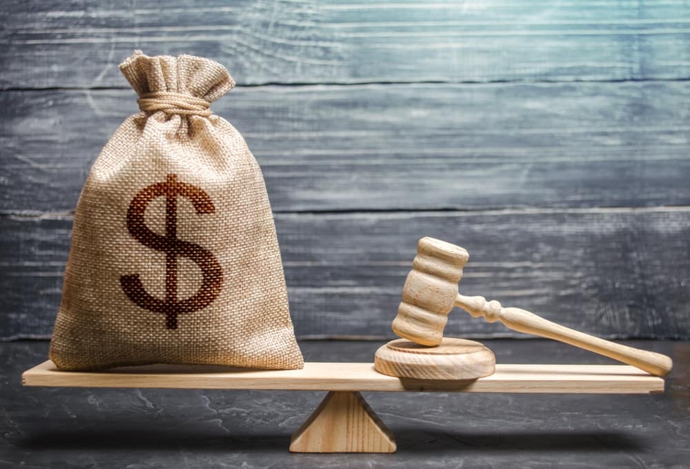 In San Diego, a bag with a dollar sign and a gavel on a scale is found at a public beach near RV parks.