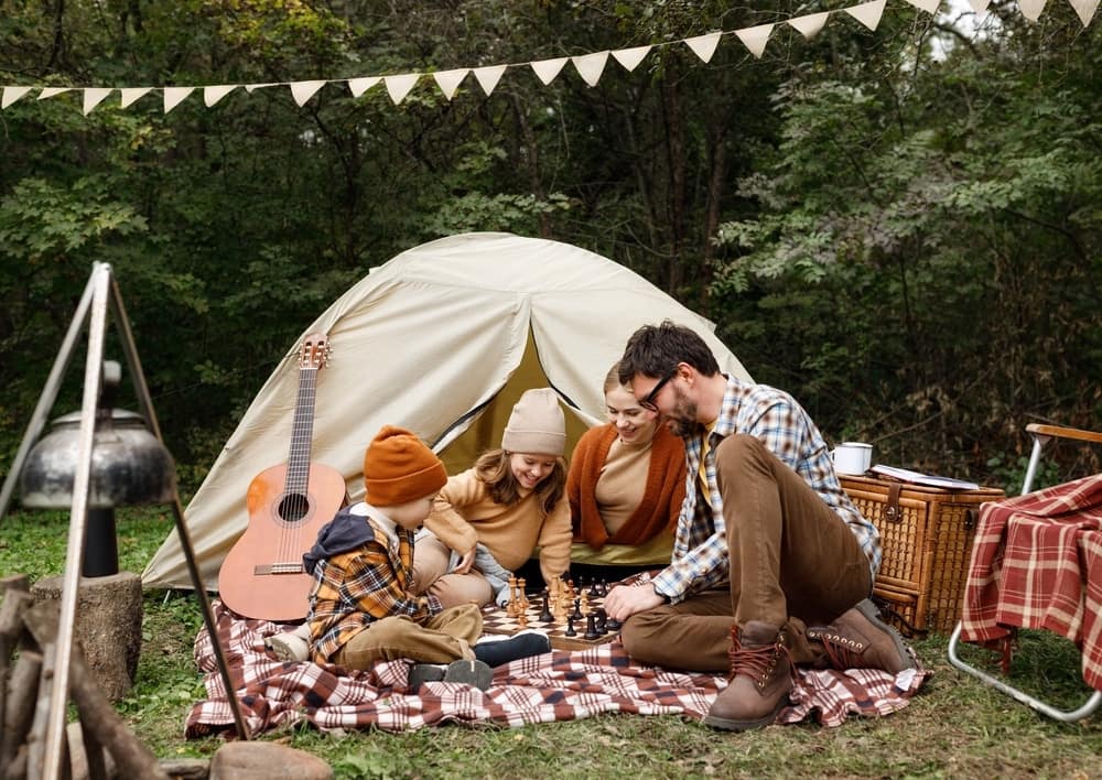 A family playing chess at Eagle Lake Campground.
