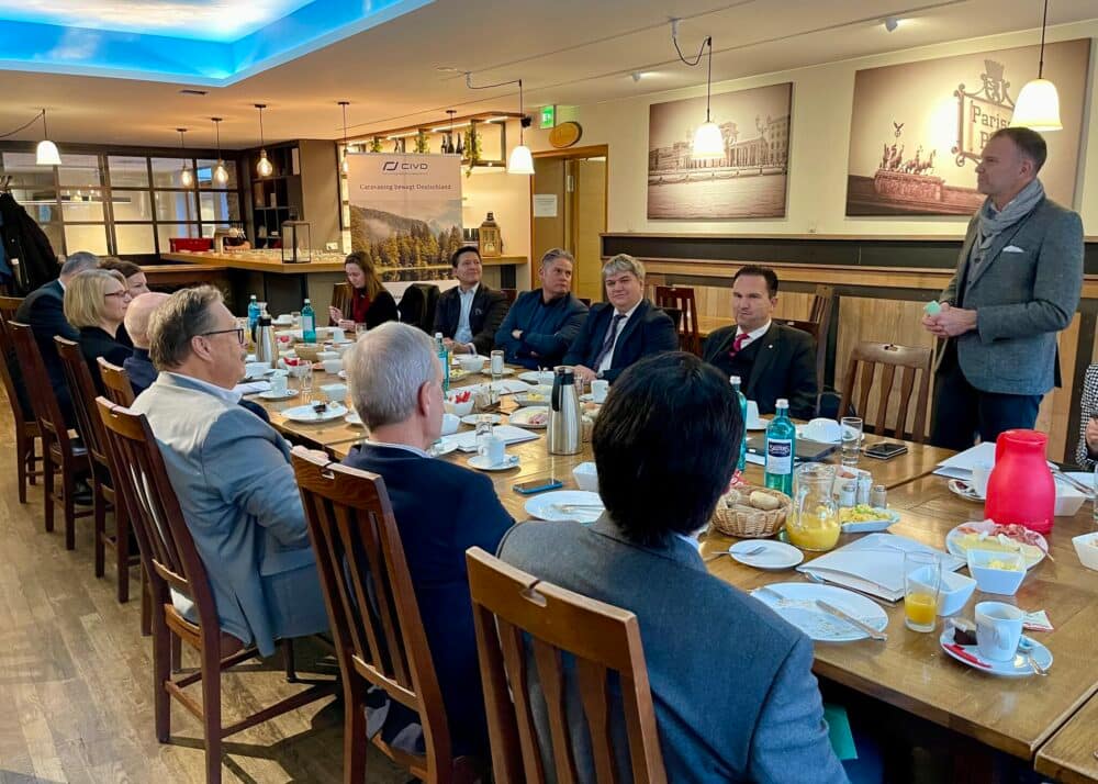 A group of people sitting around a table at a restaurant in Berlin.