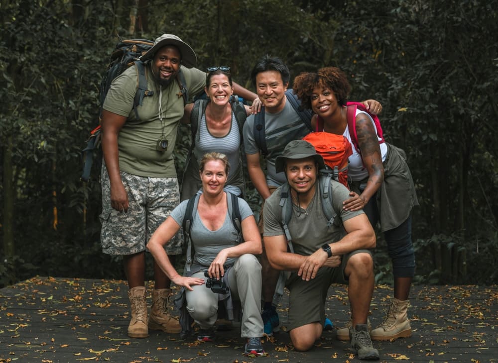 A group of people posing for a photo outdoors.