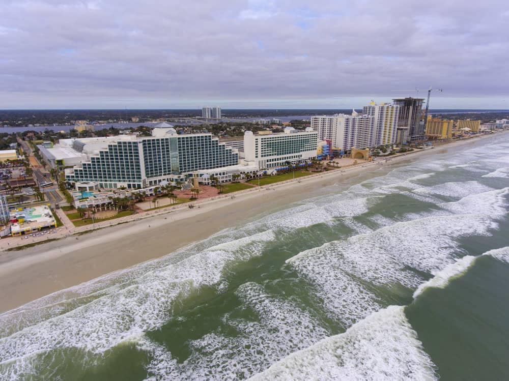 An aerial view of a beach and buildings featuring FRVCA conference registration.