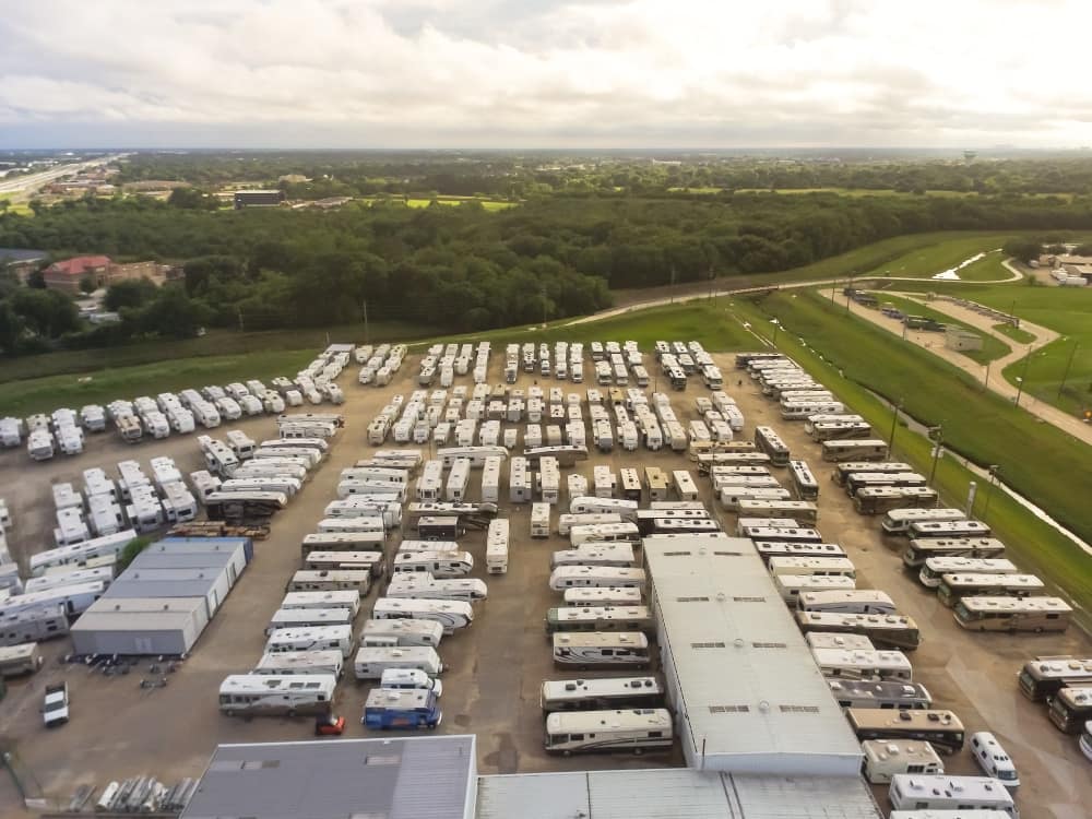 An aerial view of an rv park with many parked rvs, featuring the RVIA Chair Of The Board.