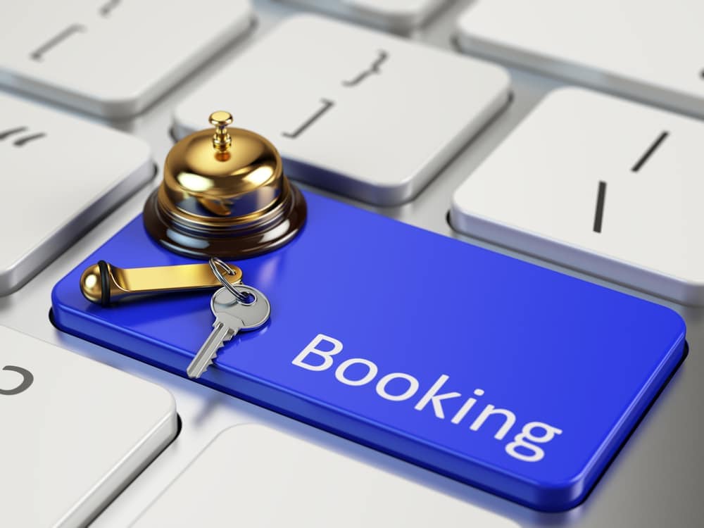 A blue button with the word booking on it.