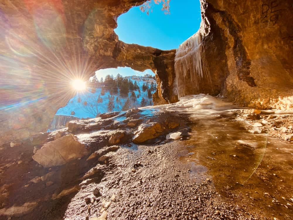 The historic Guinavah-Malibu Campground in Bryce National Park is undergoing renovations, with the sun shining through a cave enhancing the picturesque scenery.