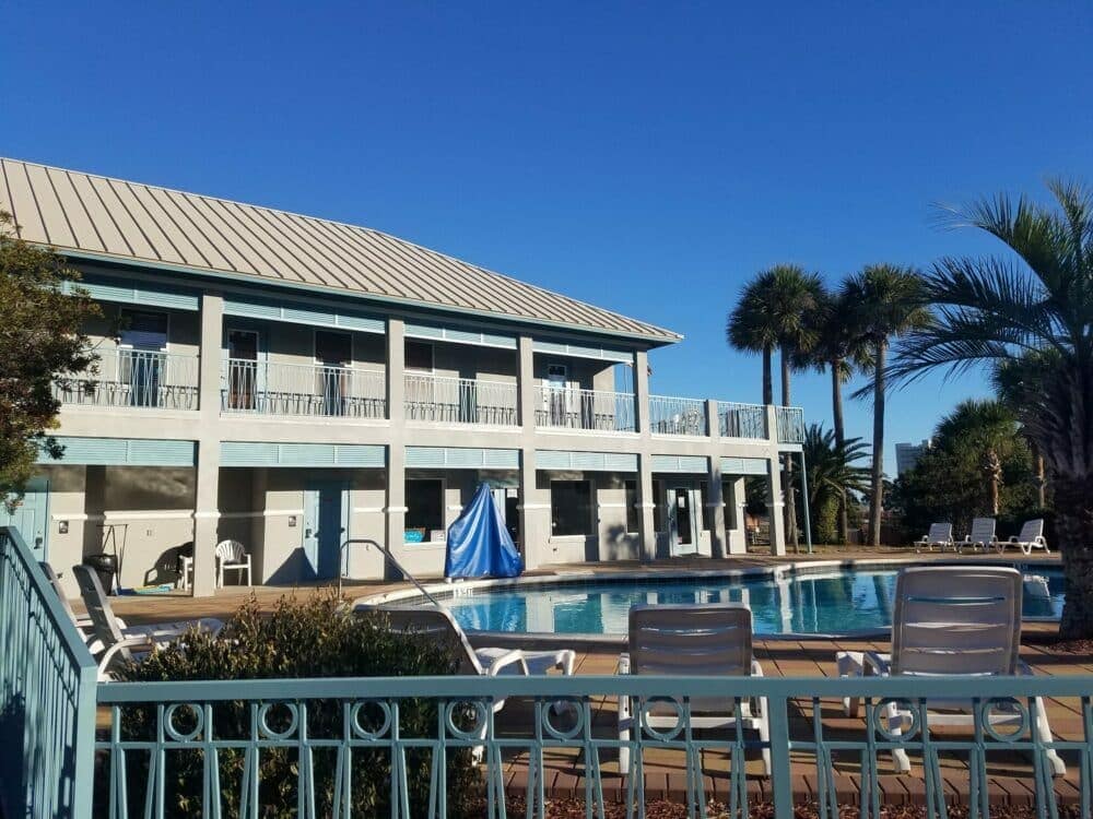 An evolving swimming pool with lounge chairs and palm trees to meet changing guest needs at an RV Resort.