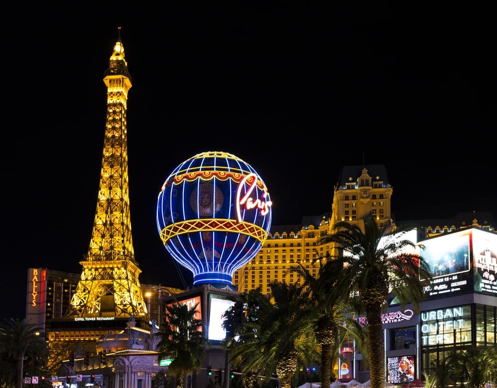 The Eiffel Tower is beautifully lit up at night.