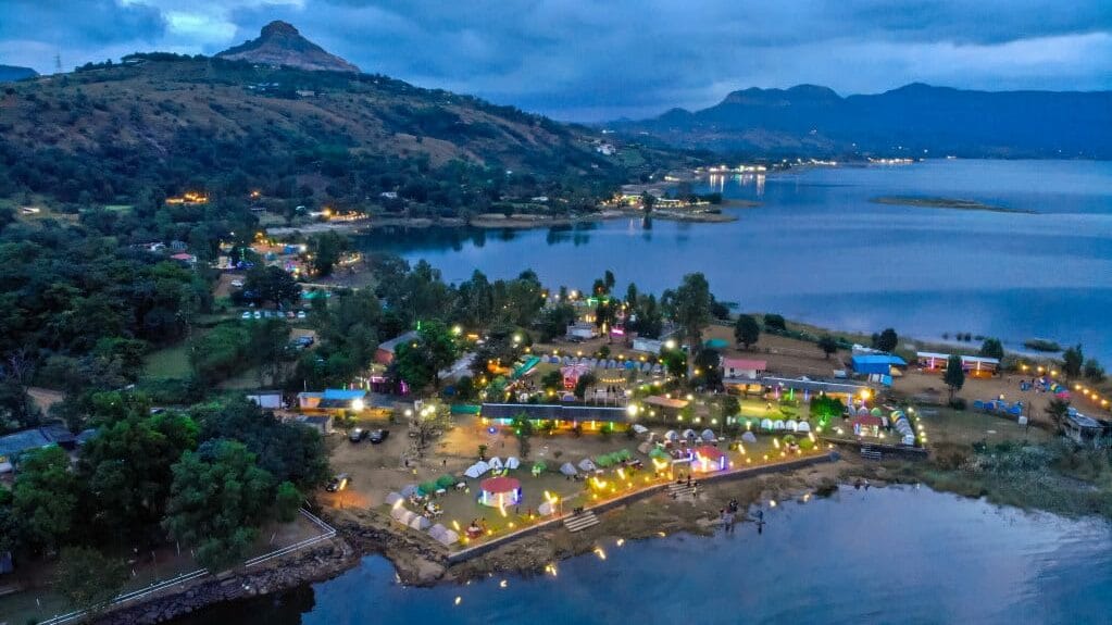 Serene aerial view of Pawna Lake at dusk.
