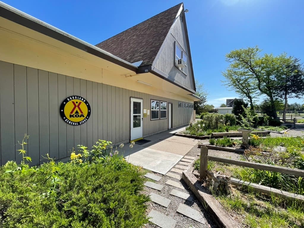 A building with a yellow sign in front of it in Goodland, Western Kansas.