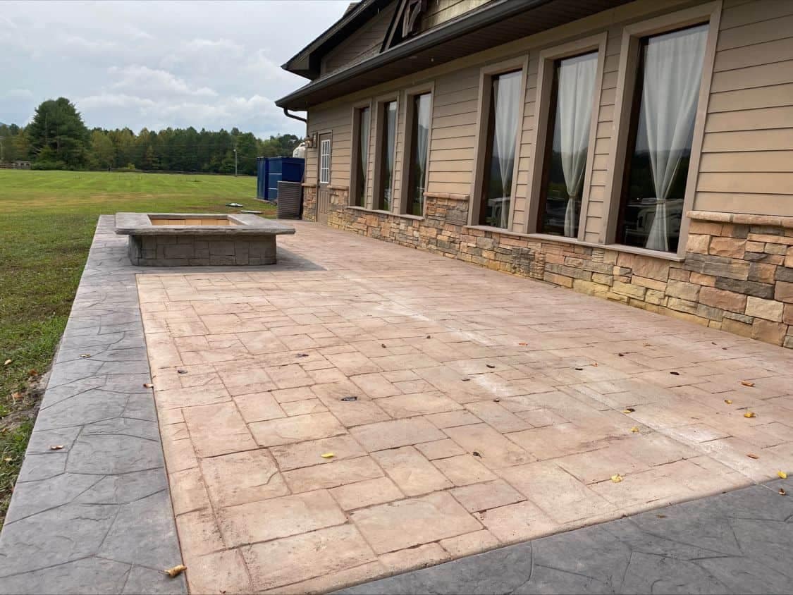 A patio with a fire pit, perfect for outdoor gatherings at Cove Creek RV Resort.